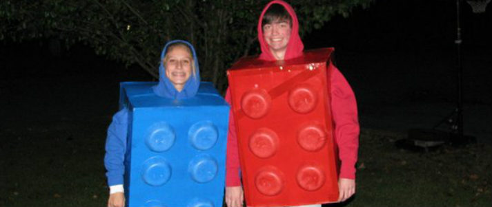two people wearing a lego costume
