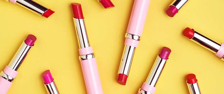 red lipsticks on yellow background