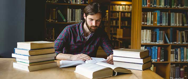 man reading in library