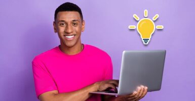 Man with laptop and lightbulb