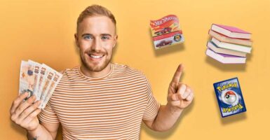 man holding cash and pointing to hotwheels, books and pokemon card
