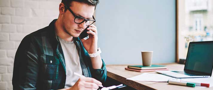 man on phone at desk