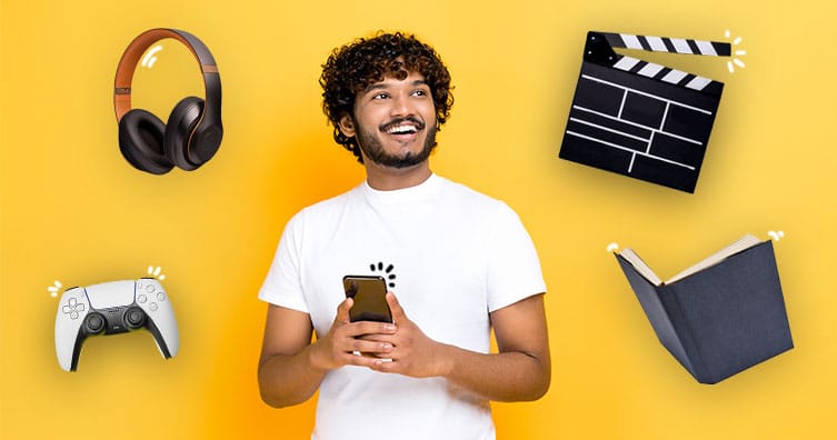 Man with phone, headphones, games controller, clapperboard and a book