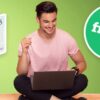 man on laptop with 5 pound note and Fiverr logo