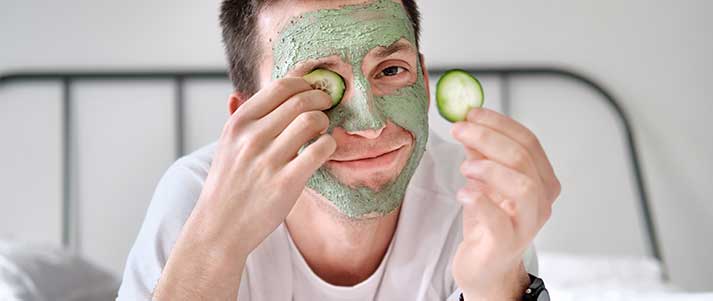 man with green face mask
