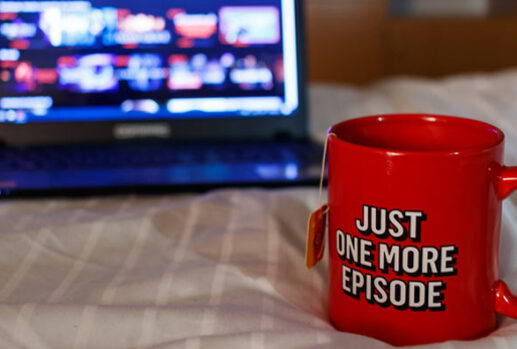 netflix cup and laptop