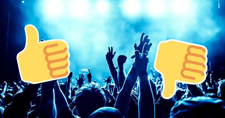 People dancing in club with thumb emojis