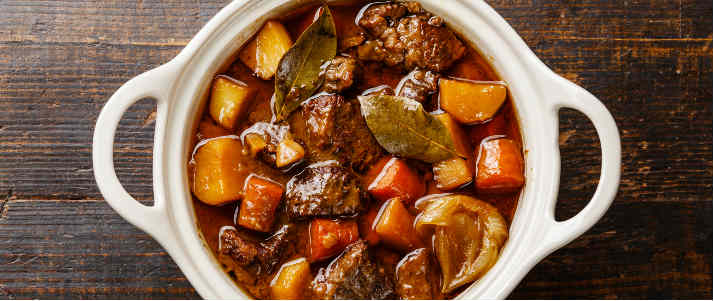 a plate filled with beef stew