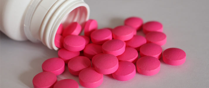 pink pills from a bottle