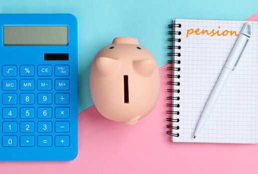 Calculator, piggy bank and notebook that says 'pension'