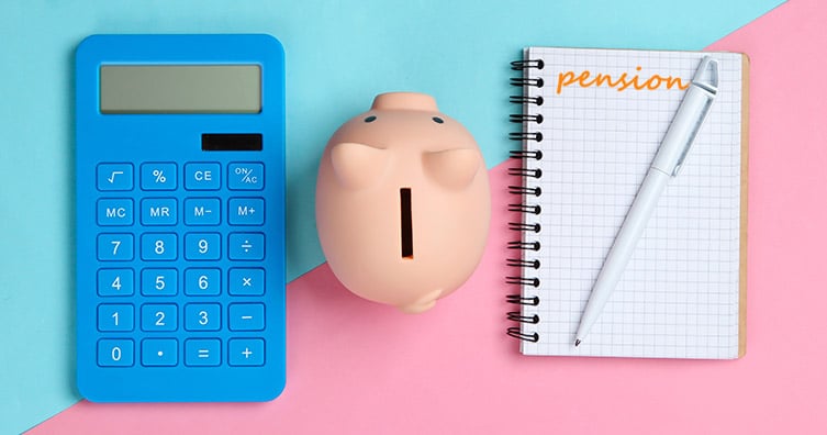 Calculator, piggy bank and notebook that says 'pension'