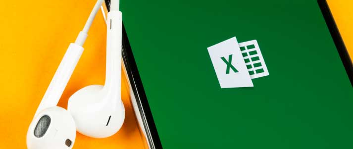 excel app on a smart phone with earphones next to it
