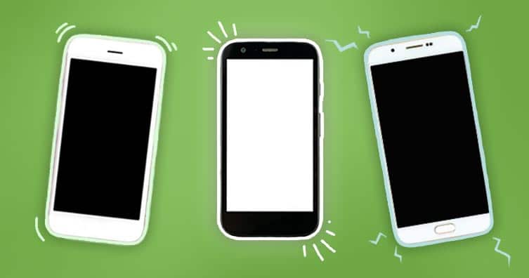 three smartphones on a green background