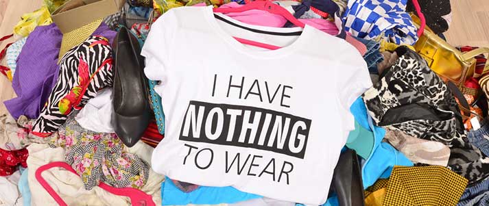 Pile of clothes with top saying nothing to wear