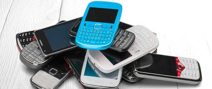 pile of old mobile phones
