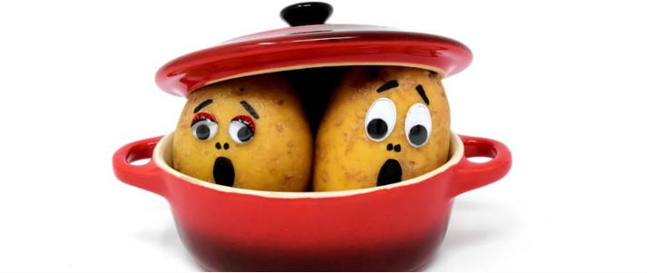 potatoes with faces in a dish
