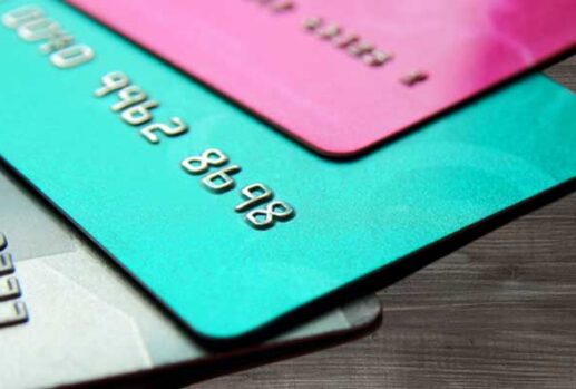 Credit cards laid out on wooden floor