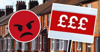 Money symbols on sign outside terraced houses