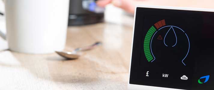 Smart meter on kitchen table by mug