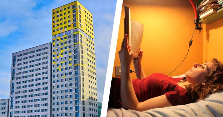 block of flats and woman in bed reading