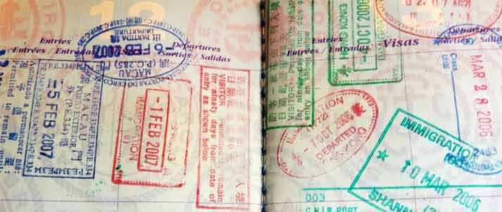 passport pages with many stamps