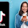 woman holding a phone and phone with tiktok logo