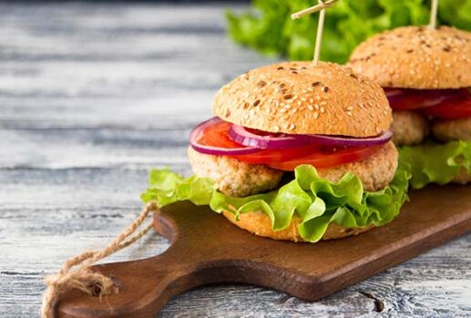 turkey burgers on wooden chopping board