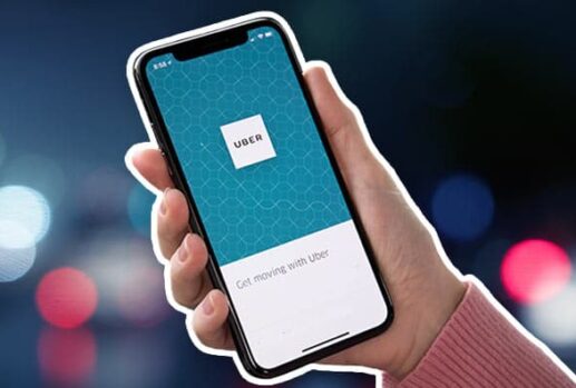 hand holding phone with uber app
