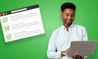 man with laptop and checklist on website