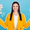 woman holding stacked books and wallet with money