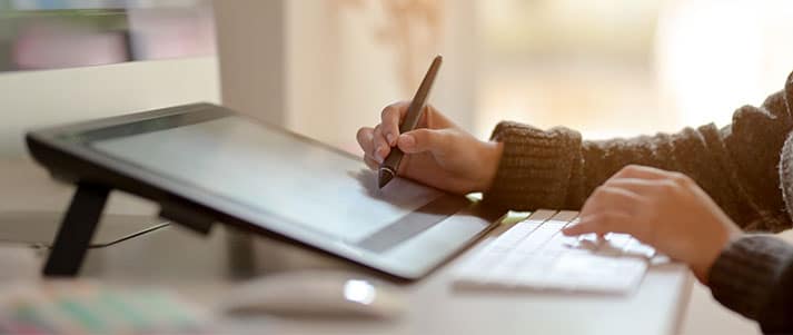 Woman drawing on tablet