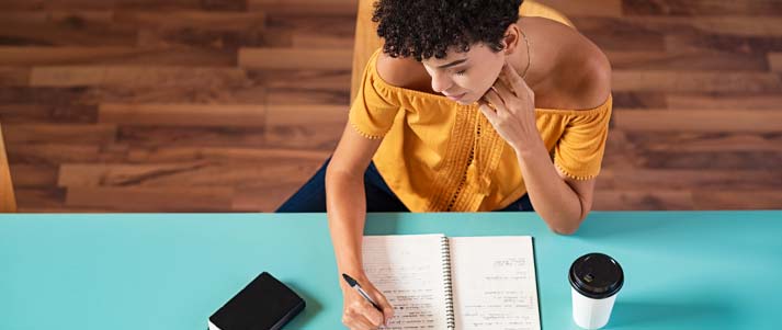 woman taking notes