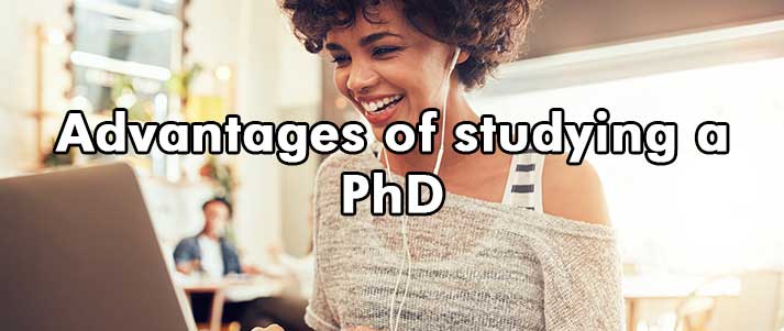 woman on laptop with text 'Advantages of studying a PhD'