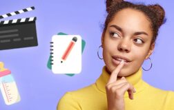 Woman thinking next to a movie clapperboard, baby bottle and notebook and pencil