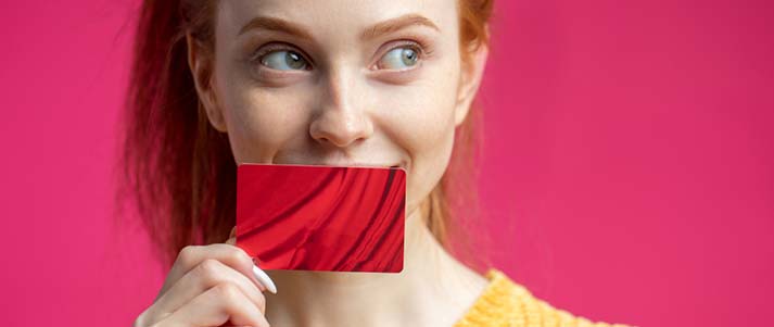 woman holding a card