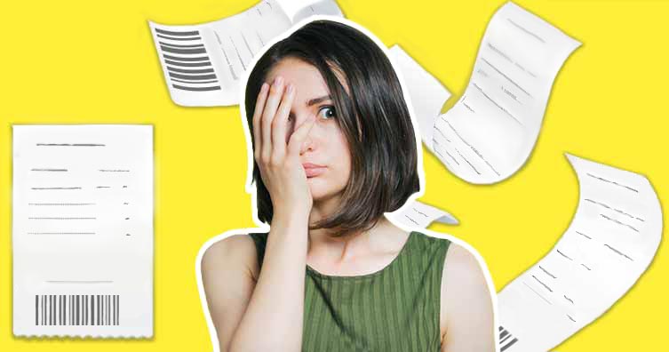 Woman surrounded by receipts